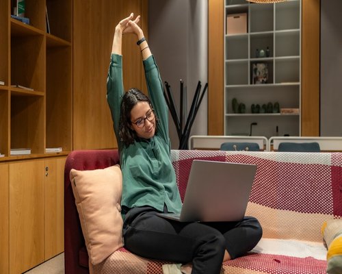 active young person doing yoga exercises at home